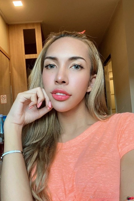 Blue-eyed Asian ladyboy shows off her alluring figure and poses provocatively